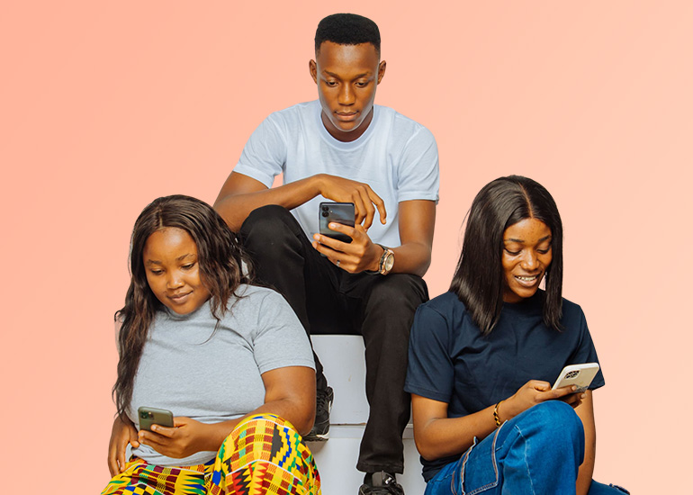 Nigerian university students using smartphones on campus - checking for student discounts and campus news