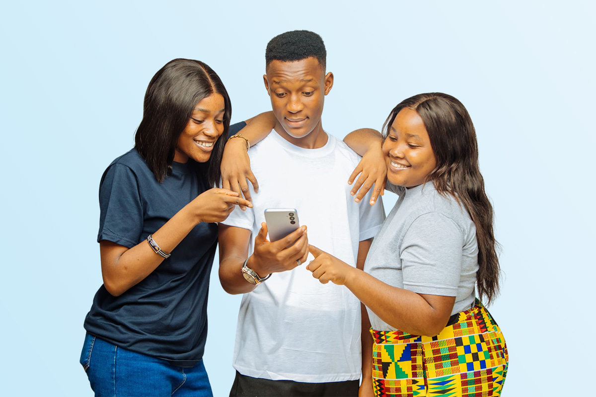 University of Abuja students excitedly reviewing STUBUD app deals on smartphone